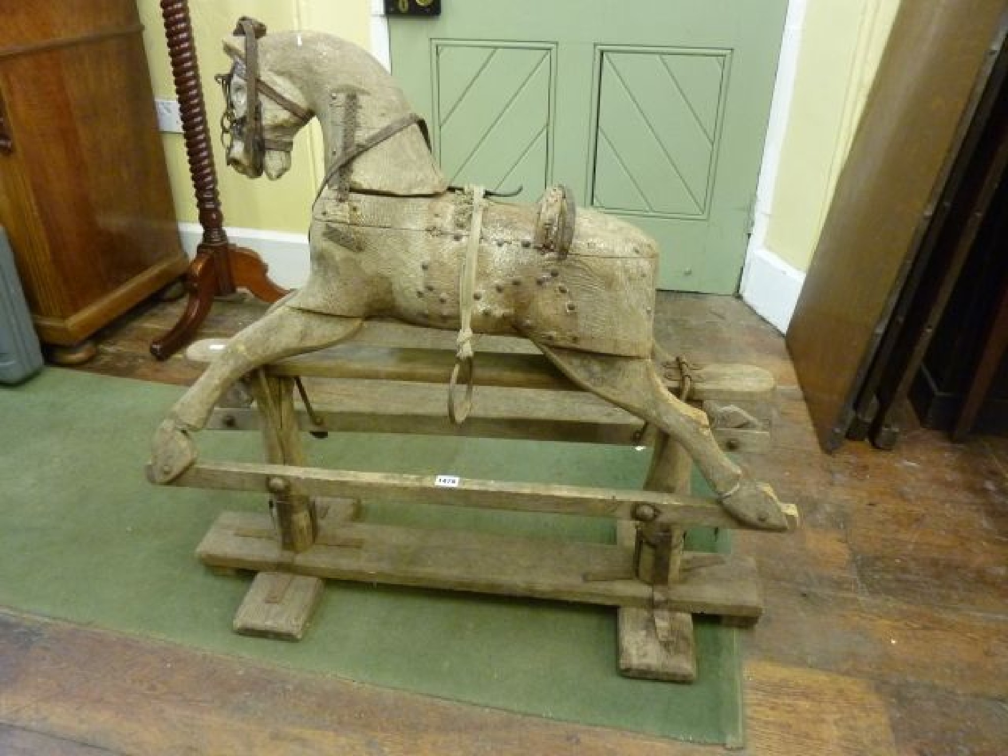 Appraisal: A Victorian pine rocking horse lacking all paint and original