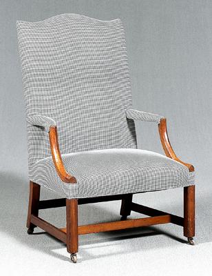 Appraisal: Federal mahogany lolling chair arched crest shaped arms molded legs