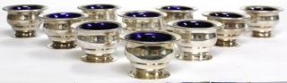 Appraisal: Mid Comprising small unadorned cups with blue glass liners bearing