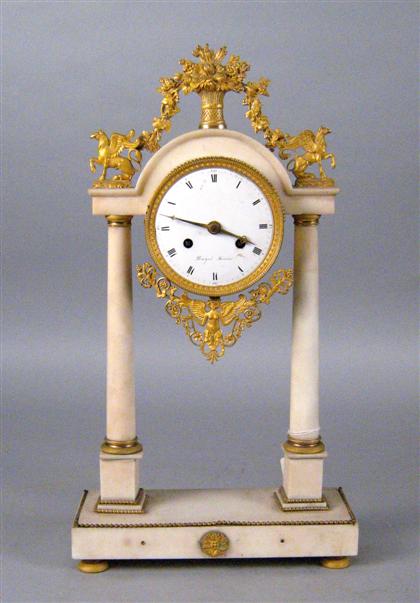 Appraisal: French gilt bronze mounted marble temple clock th century The