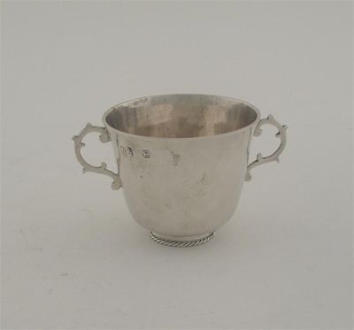 Appraisal: A late Charles II small two handled cup on a