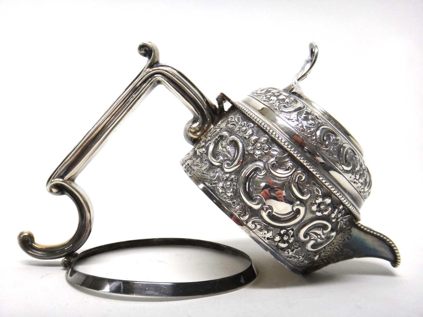 Appraisal: A silver mount from a claret jug with floral foliate