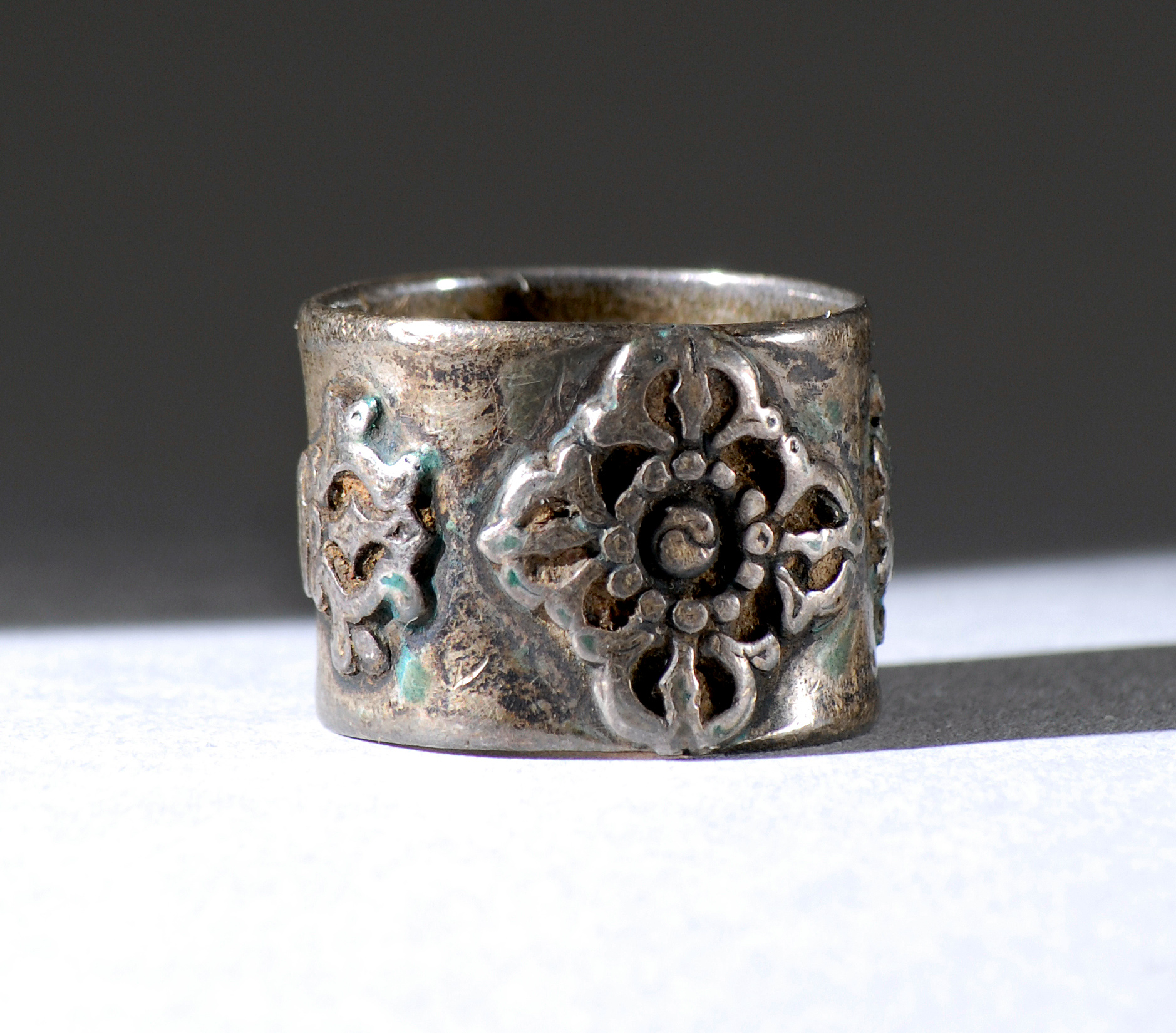 Appraisal: TIBETAN SILVER RING th th CenturyWith relief vajra and double