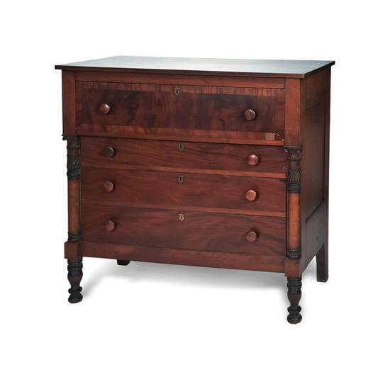 Appraisal: EMPIRE CHEST OF DRAWERS Mahogany and mahogany veneer having carved