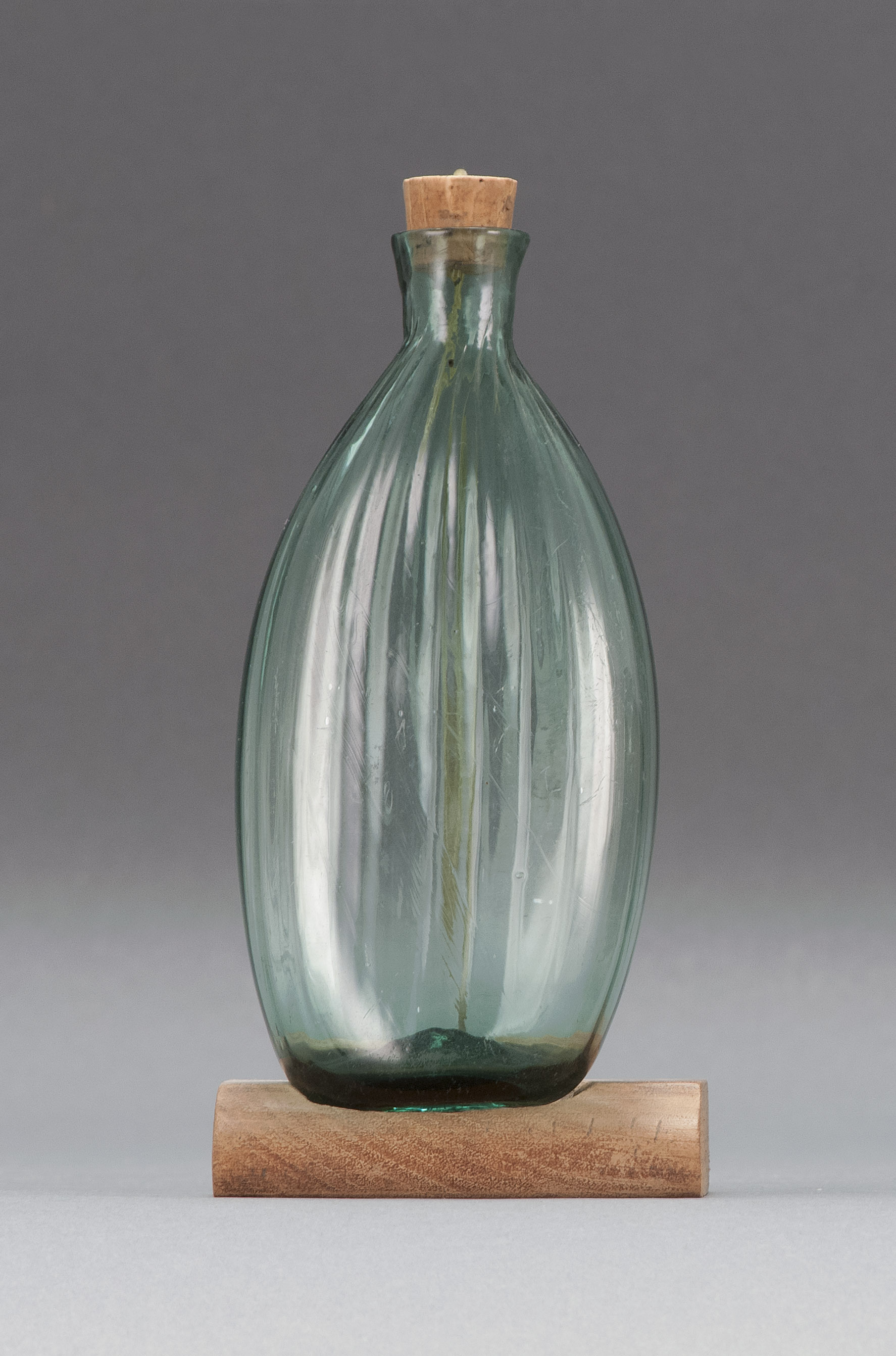 Appraisal: BLOWN-MOLDED GLASS FLASK Early th CenturyProbably Ohio In medium green