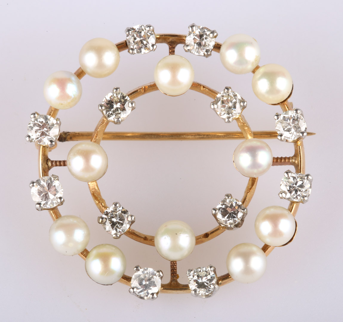 Appraisal: A Pearl and Diamond Circular Brooch K c 's classic