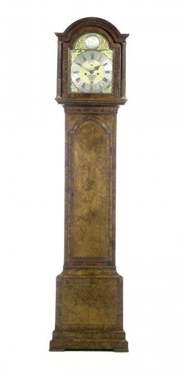 Appraisal: A GEORGE II WALNUT LONGCASE CLOCK the brass breakarched dial