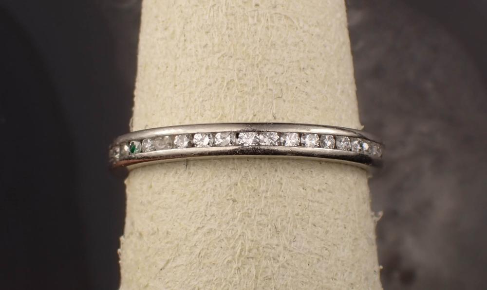 Appraisal: DIAMOND AND PLATINUM ETERNITY RING The platinum ring channel set