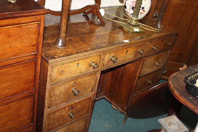 Appraisal: A TH CENTURY OAK AND MAHOGANY CROSSBANDED WRITING DESK fitted