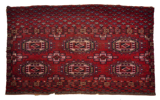 Appraisal: AN ANTIQUE TEKKE TURKOMAN WINE GROUND JUVAL with three rows