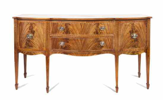 Appraisal: A Georgian Style Flame Mahogany Sideboard having a shaped top