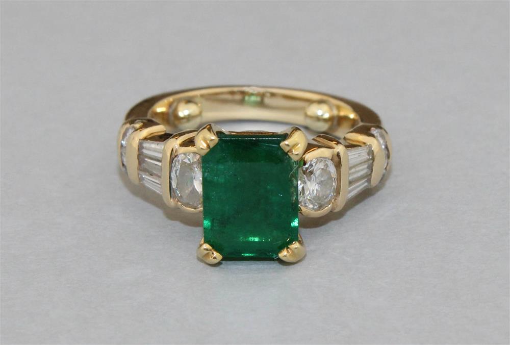 Appraisal: K GOLD EMERALD AND DIAMOND RING the emerald measures approx