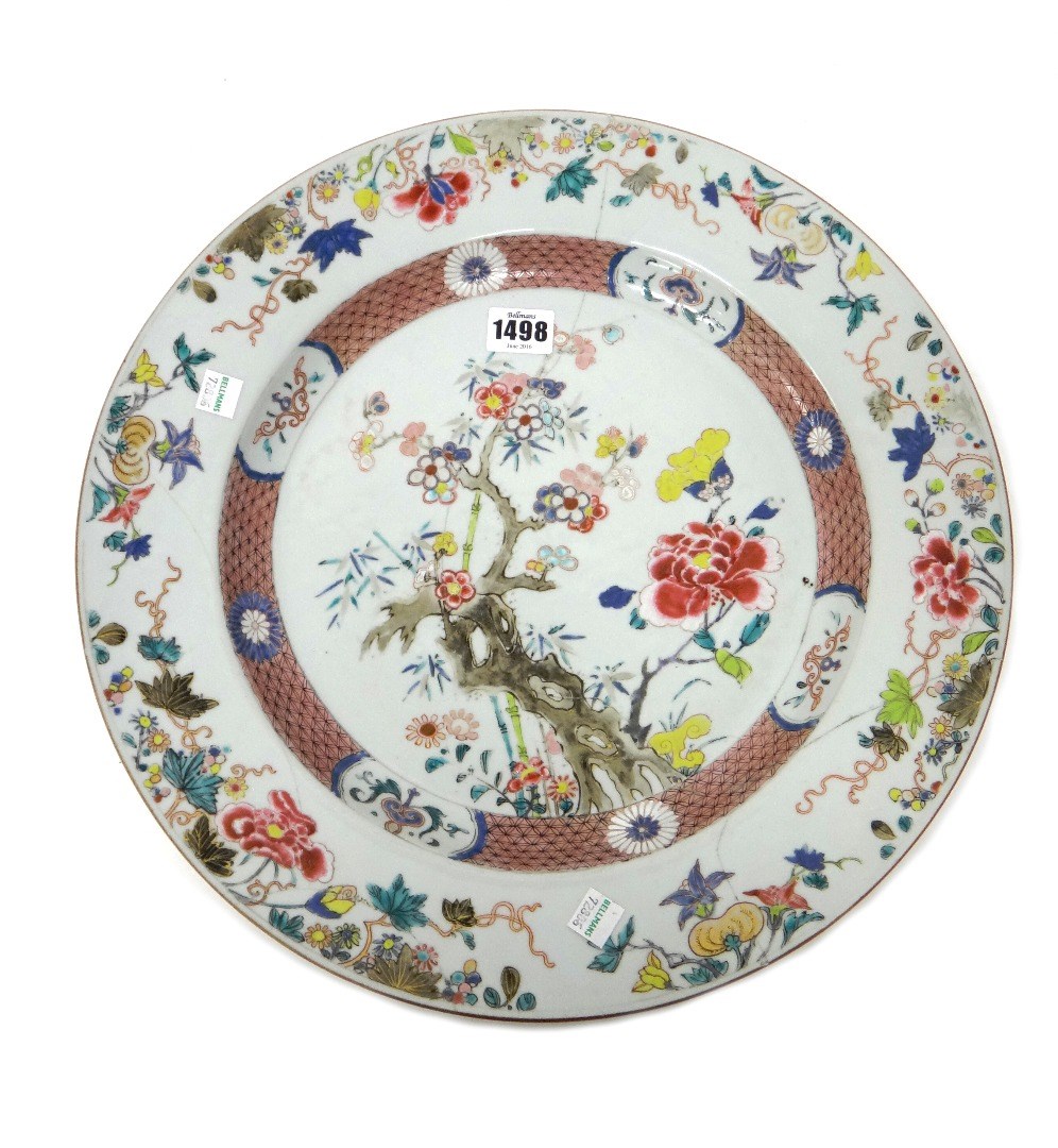 Appraisal: A Chinese famille-rose charger Yongzheng early Qianlong painted with flowering