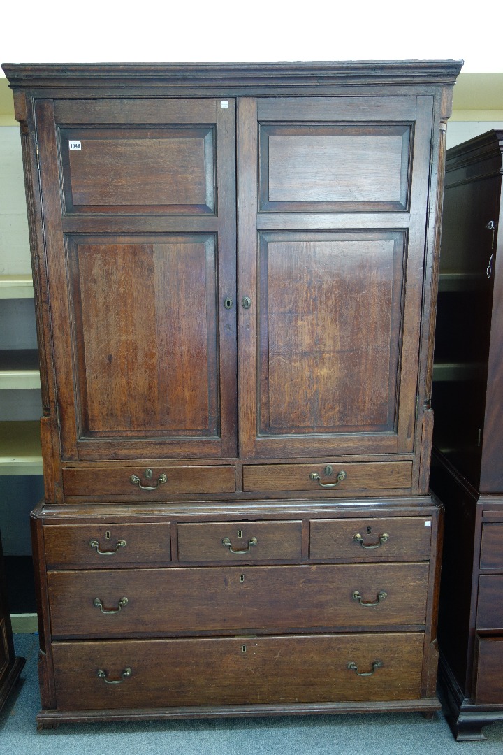 Appraisal: An th century oak press cupboard the pair of double