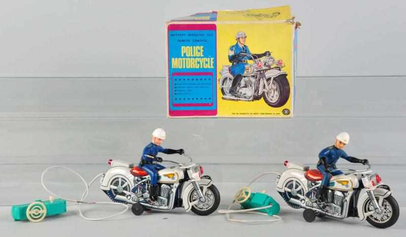 Appraisal: Lot of Police Motorcycle Battery-Op Toys Japanese Working Includes two