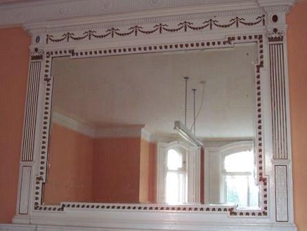 Appraisal: A late th Century overmantel mirror with breakfront cornice swags