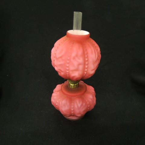 Appraisal: Cranberry Art Glass Miniature Oil Lamp puffy ribbed design cased