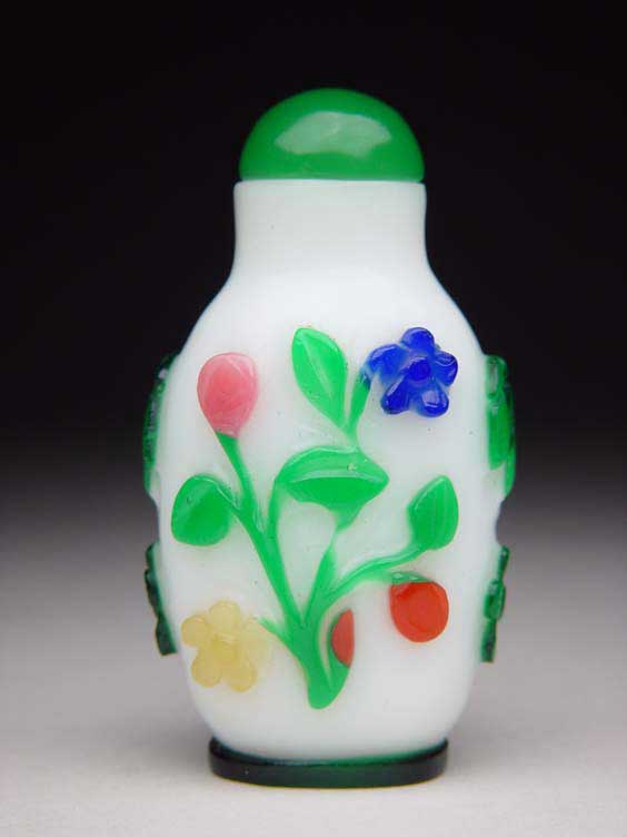 Appraisal: FIVE-COLOR OVERLAY GLASS SNUFF BOTTLE Carved five-color overlay glass snuff