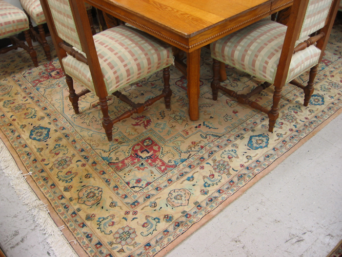 Appraisal: HAND KNOTTED ORIENTAL CARPET Indo-Heriz central medallion and overall stylized