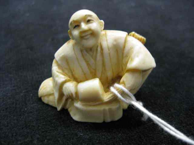 Appraisal: Carved Ivory Netsuke of Seated Manat work '' signed excellent