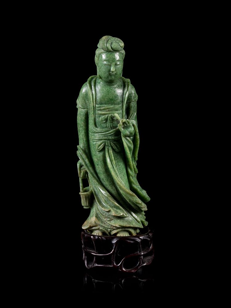 Appraisal: A Mottled Green Jade Figure of Guanyin Height in cm