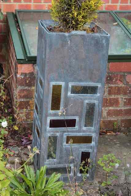 Appraisal: A SET OF FOUR TALL SQUARE SECTION LEAD PLANTERS each