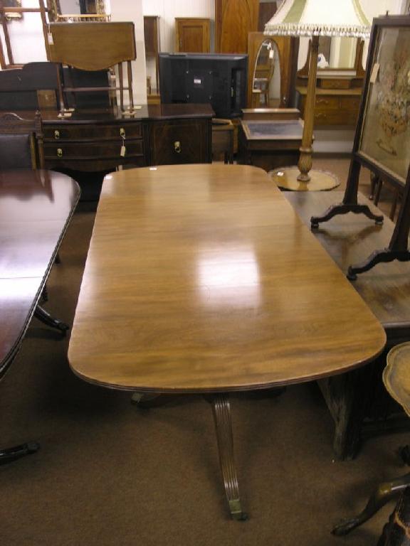 Appraisal: A Georgian style 'D' end mahogany dining table on twin