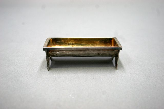 Appraisal: A sterling silver trinket dish modelled as a log trough