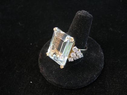 Appraisal: karat yellow gold aquamarine and diamond dinner ring Large step