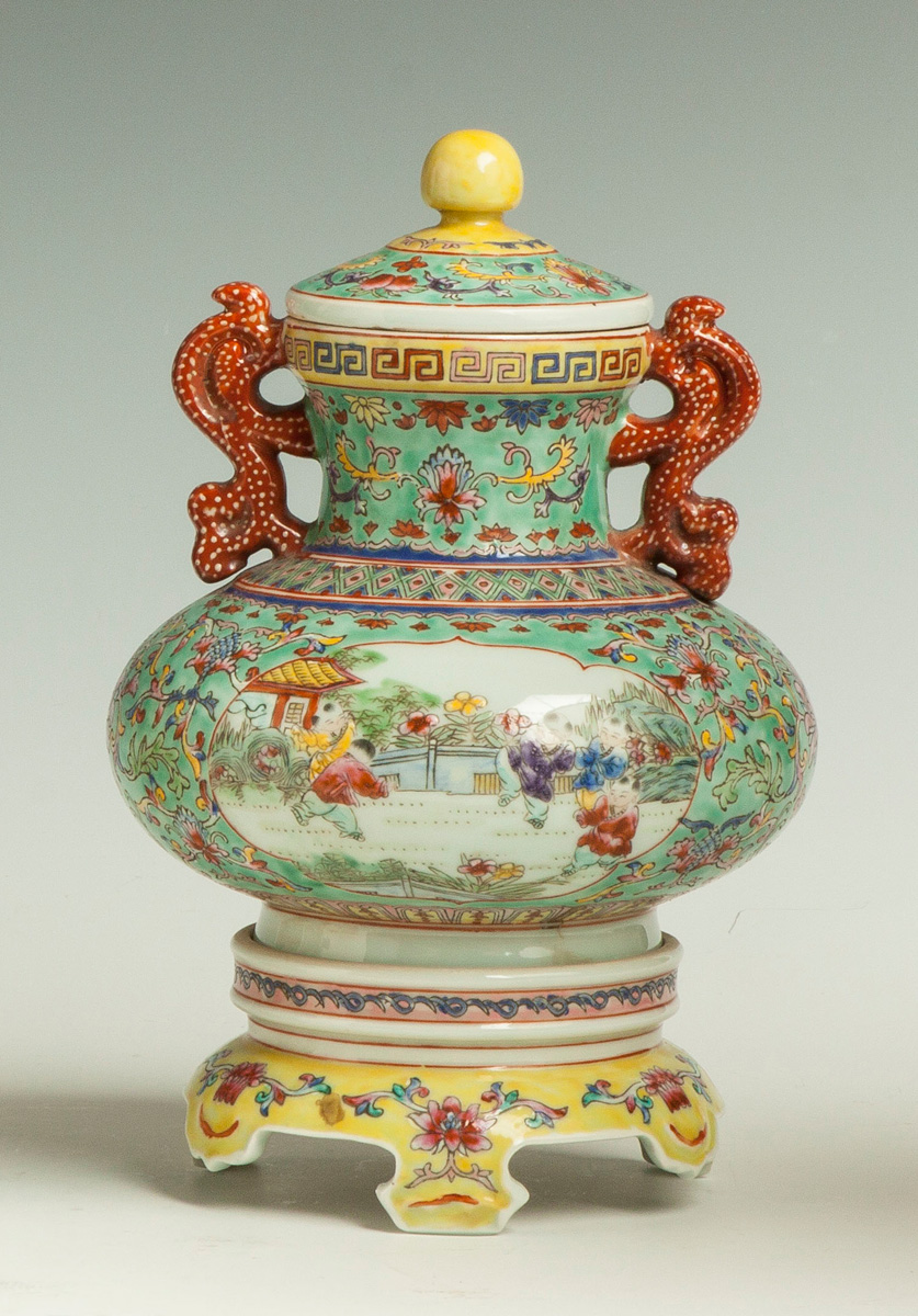 Appraisal: Chinese Porcelain Famille Covered Urn on Base with Scenic Panels