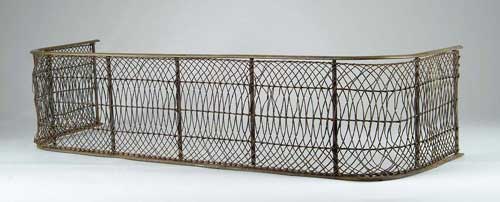 Appraisal: TH CENTURY IRON AND BRASS FIREPLACE FENDER Nice wire work