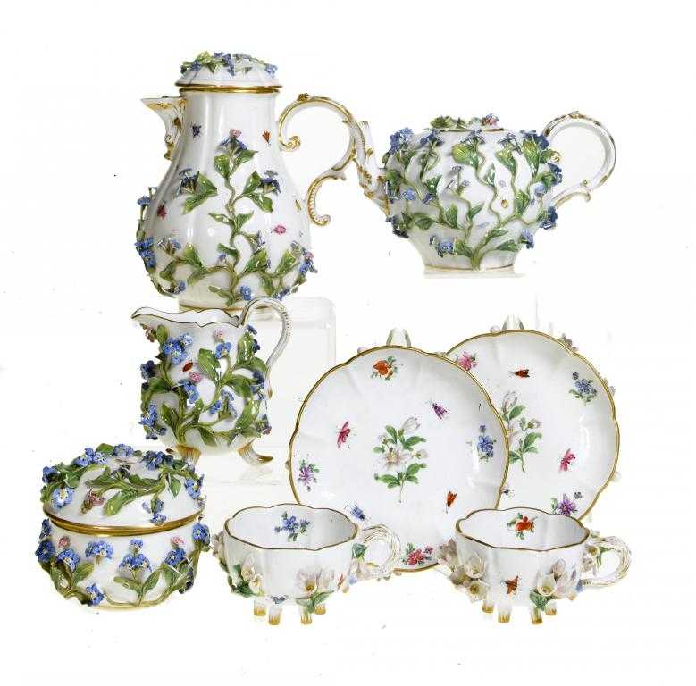 Appraisal: A MEISSEN FLORAL ENCRUSTED TEA SERVICE painted in bright enamels