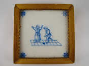 Appraisal: A framed antique Dutch tile showing children at play