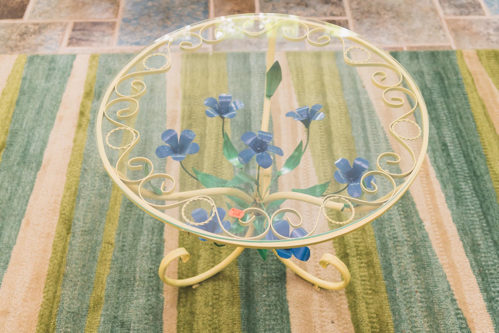 Appraisal: Enamel metal and glass top circular side table with blue