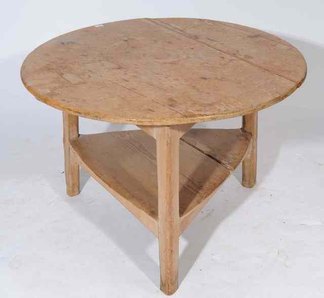 Appraisal: AN ANTIQUE PINE CIRCULAR CRICKET TABLE with under tier and