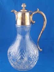 Appraisal: A silver plate mounted claret jug with artichoke finial and