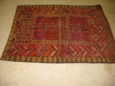 Appraisal: A HATCHLI RUG the red field divided into four panels