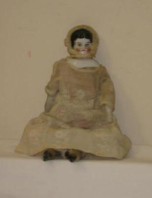 Appraisal: A china shoulder head girl doll with painted face and