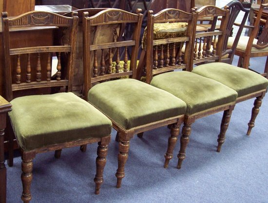 Appraisal: A set of four Edwardian spindle back chairs on turned