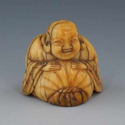 Appraisal: A Carved Ivory Netsuke of a Seated Buddha Edo Period