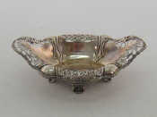 Appraisal: A silver lobed shaped oval sweetmeats dish with pierced roll