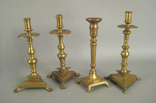 Appraisal: Pair of Continental brass candlesticks th c with mid drip