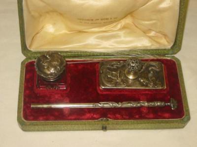 Appraisal: AN EPNS ART NOUVUEAU DESK SET comprising glass inkwell blotter