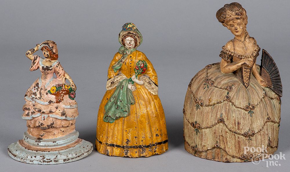 Appraisal: Three cast iron women doorstops Three cast iron women doorstops