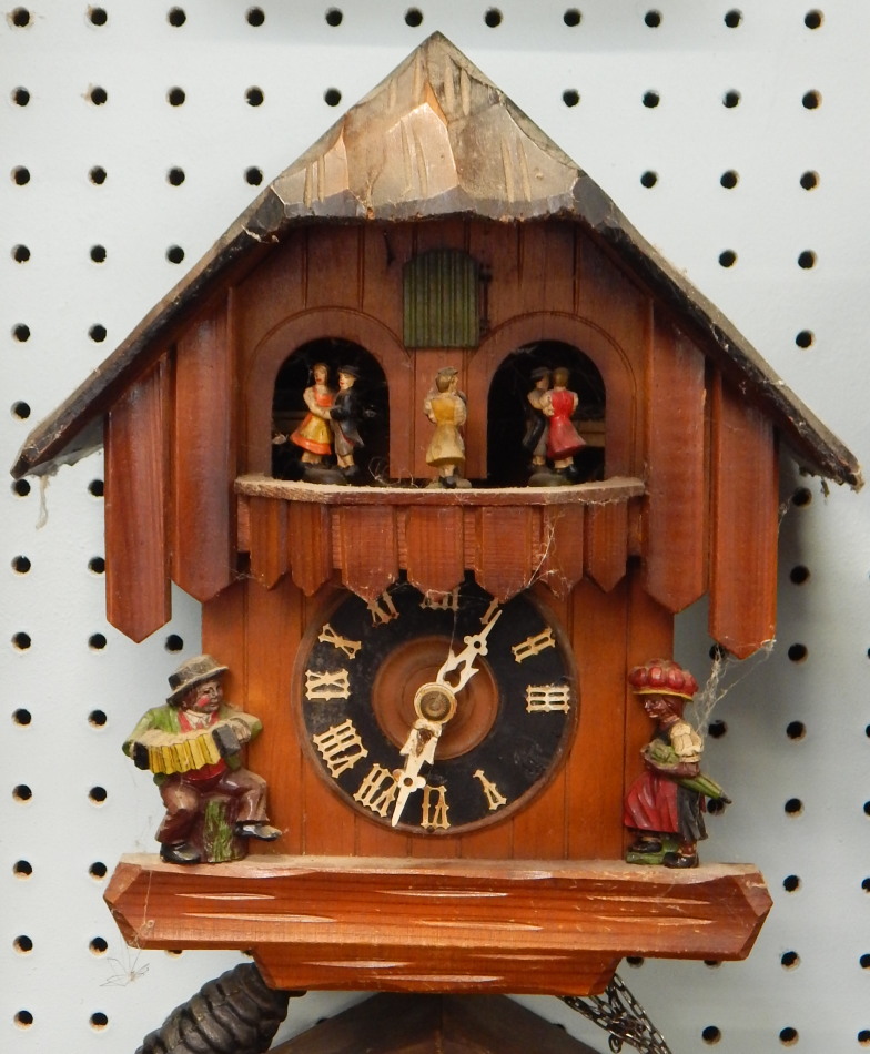 Appraisal: A Black Forest type cuckoo clock carved with figures etc