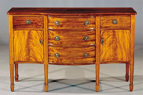 Appraisal: George III style mahogany serpentine sideboard circa shaped top and