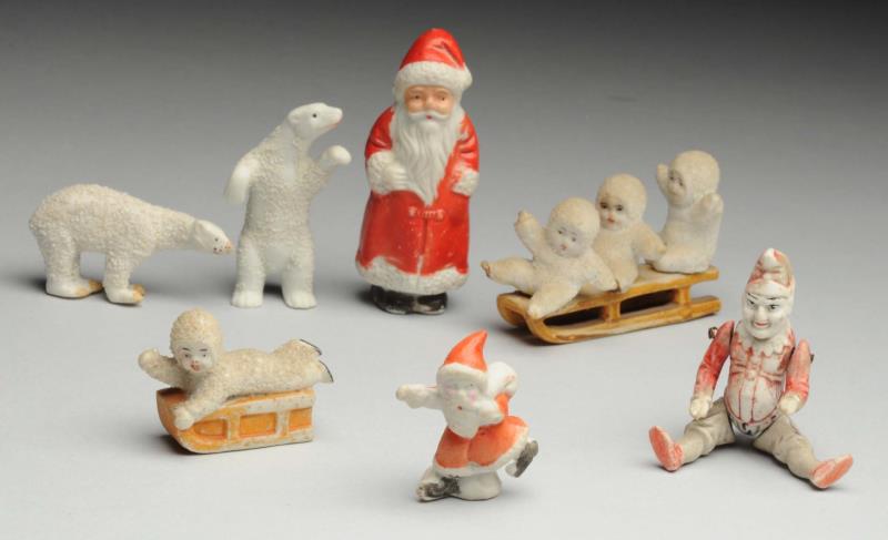 Appraisal: Lot Of Piano Babies and Figures Three babies on sled