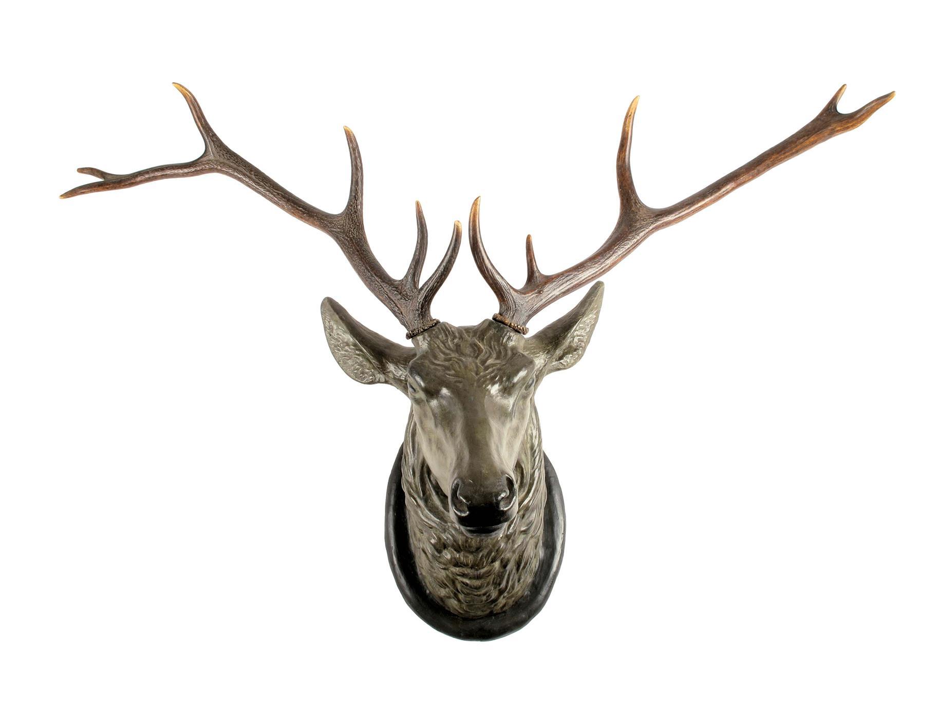 Appraisal: A painted terracotta stag s head wall trophy