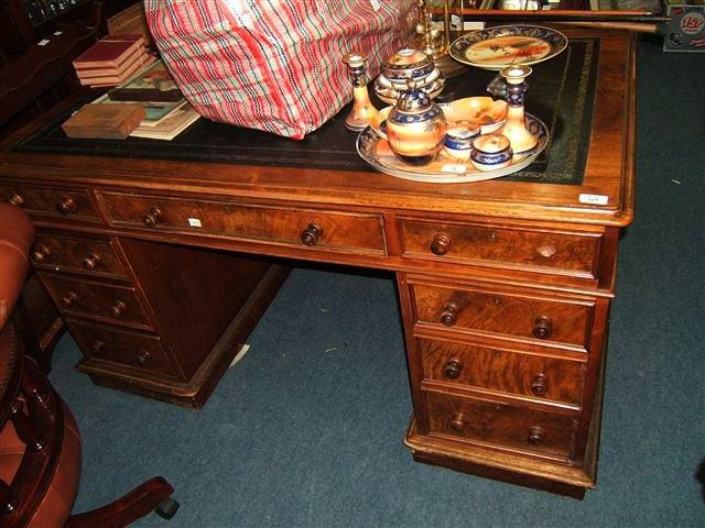 Appraisal: A Victorian walnut pedestal desk with leather inset top wide