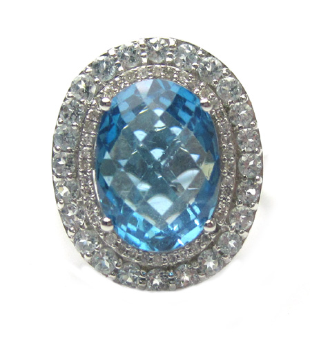 Appraisal: BLUE TOPAZ AND FOURTEEN KARAT WHITE GOLD RING with round-cut